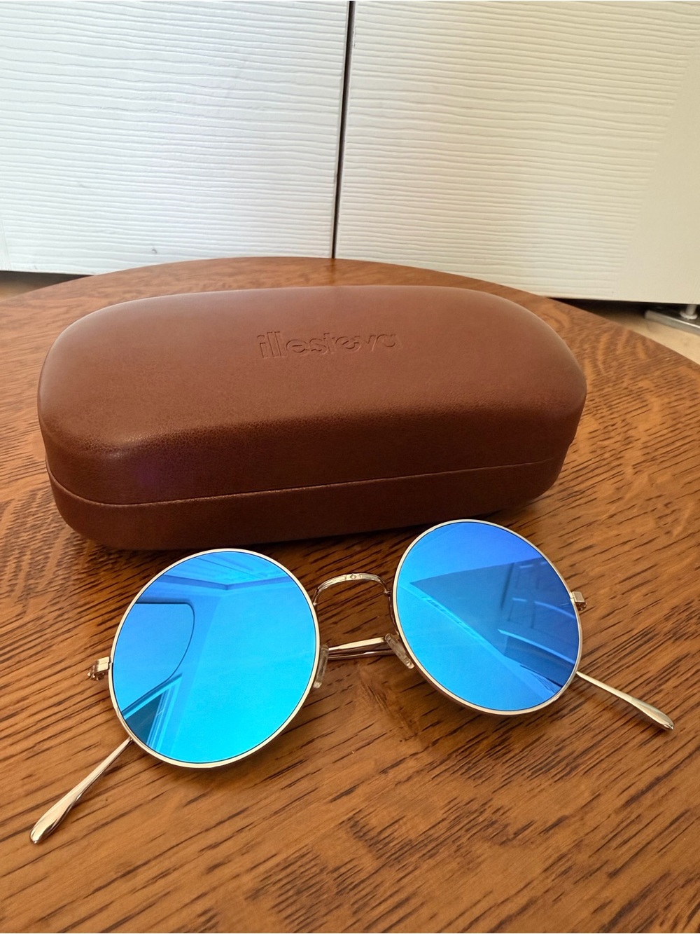 Illesteva Porto Cervo Round Silver Frame Sunglasses with Blue Mirrored Lenses